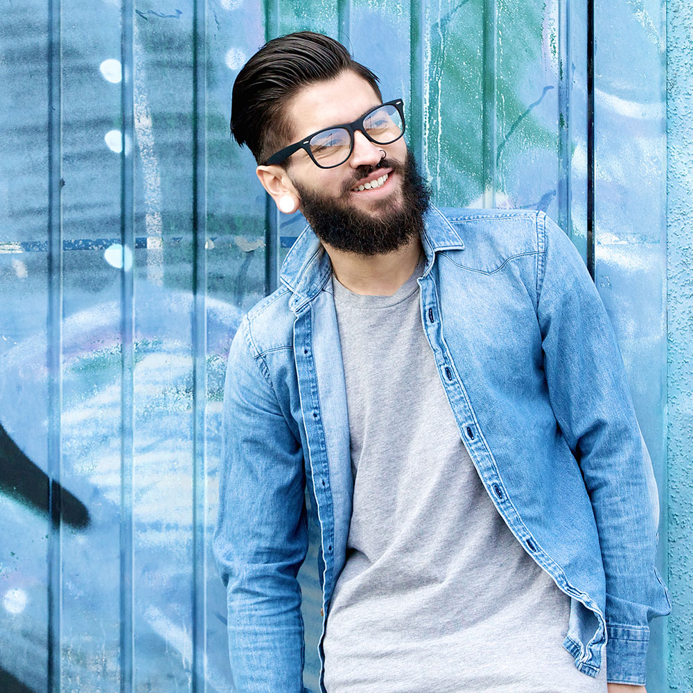 smiling-man-with-beard-and-glasses-PHWGANP-1.jpg